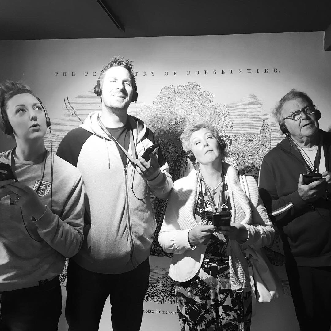 The Lovelass group with their headphones at shire hall 